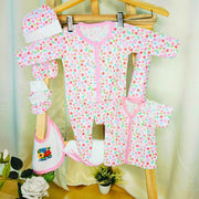 Cutetales Baby clothing set with floral pattern on a wooden hanger against a light background