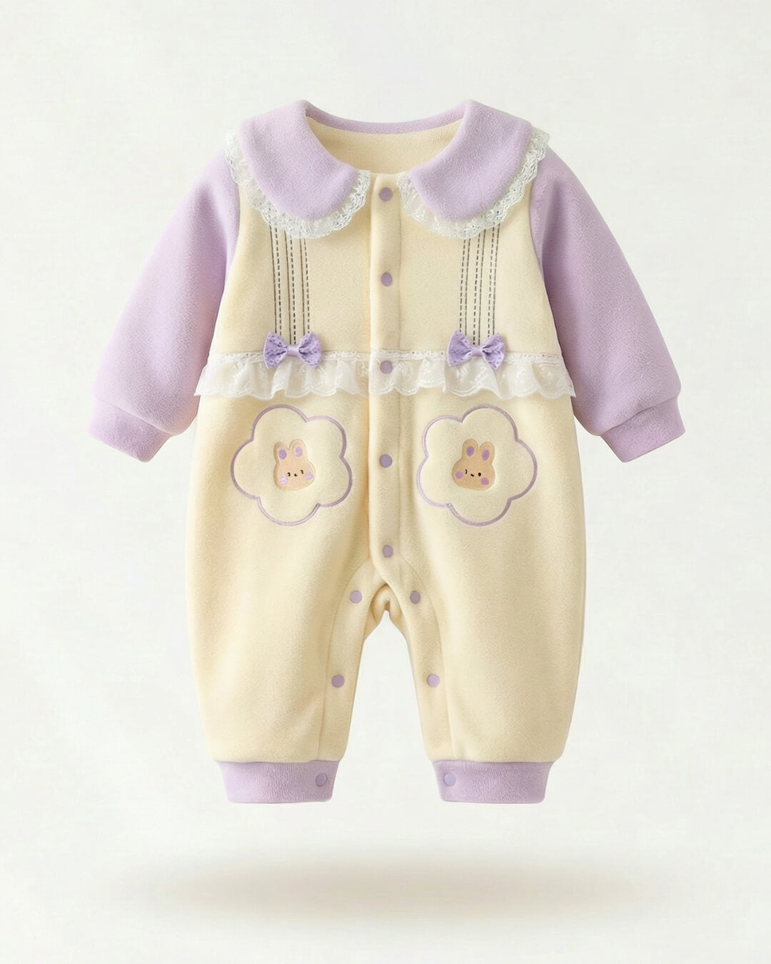 Baby romper with purple accents and floral designs on a white background