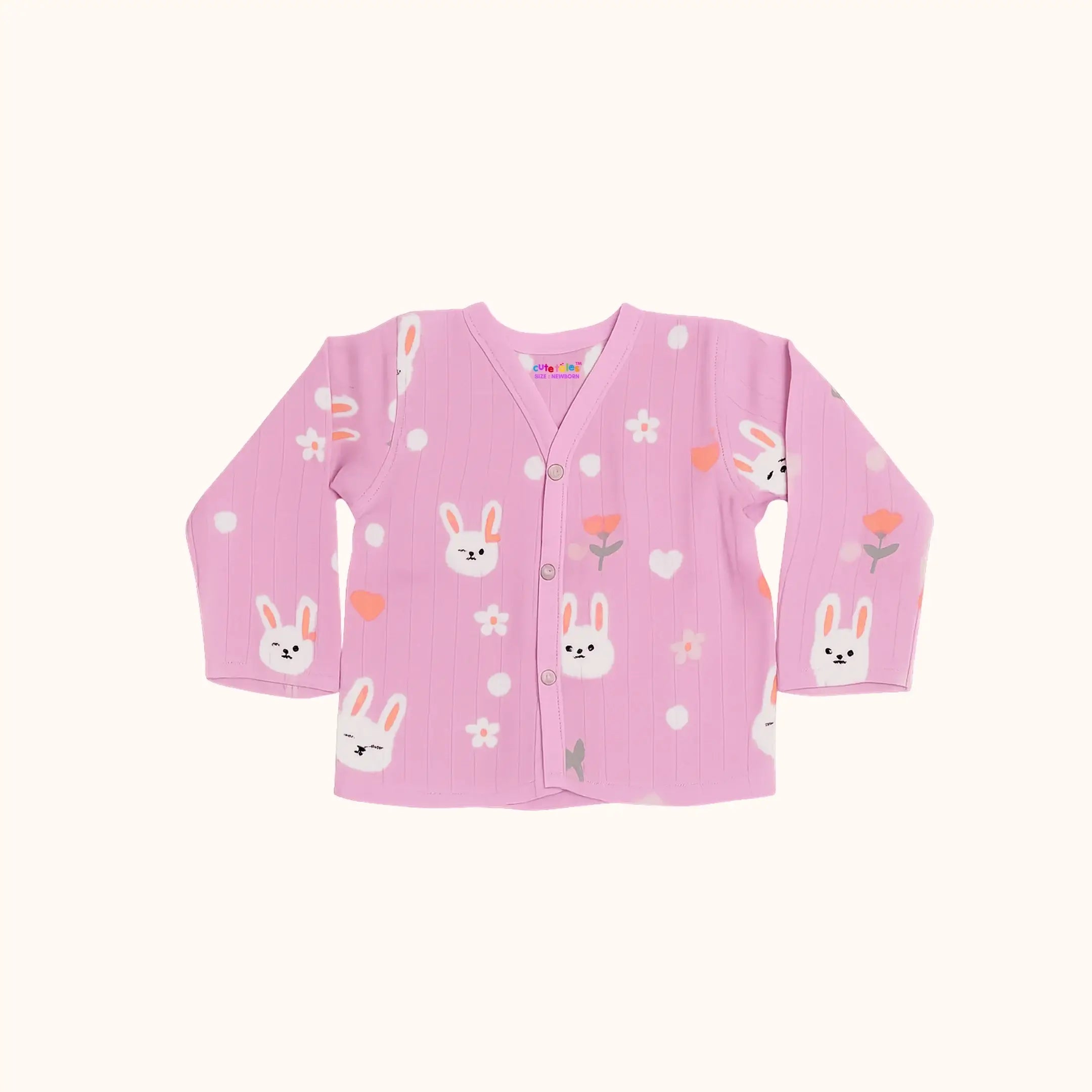 Pink children's cardigan with bunny and flower patterns on a white background
