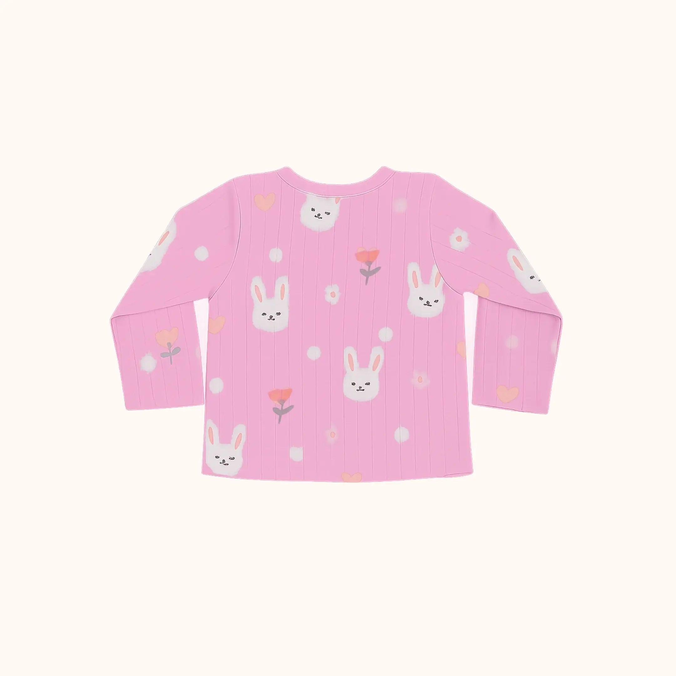 Pink long-sleeve shirt with bunny and flower patterns on a white background