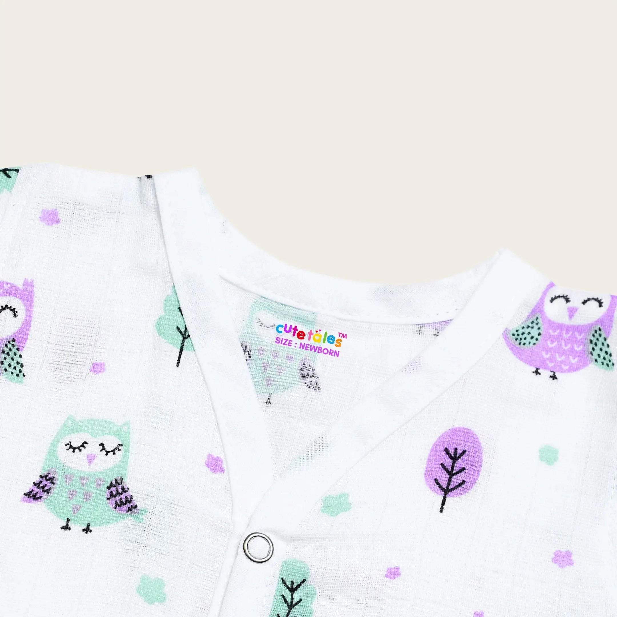 Baby outfit with owl pattern on a white background