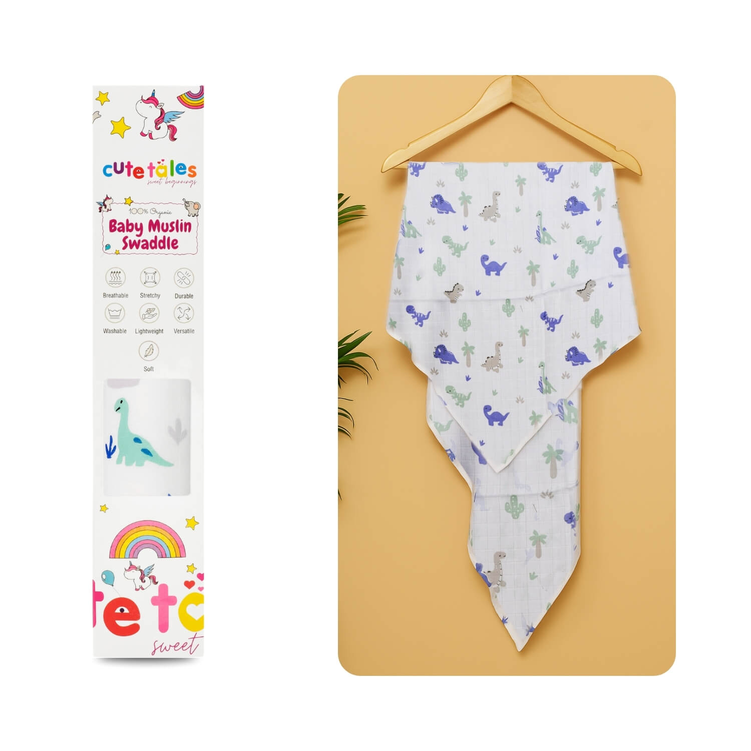 Cutetales Baby swaddle with dinosaur pattern on a yellow board next to its packaging.