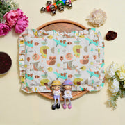 Cotton Fabric pillow with nature-themed pattern on a wooden board with decorative items