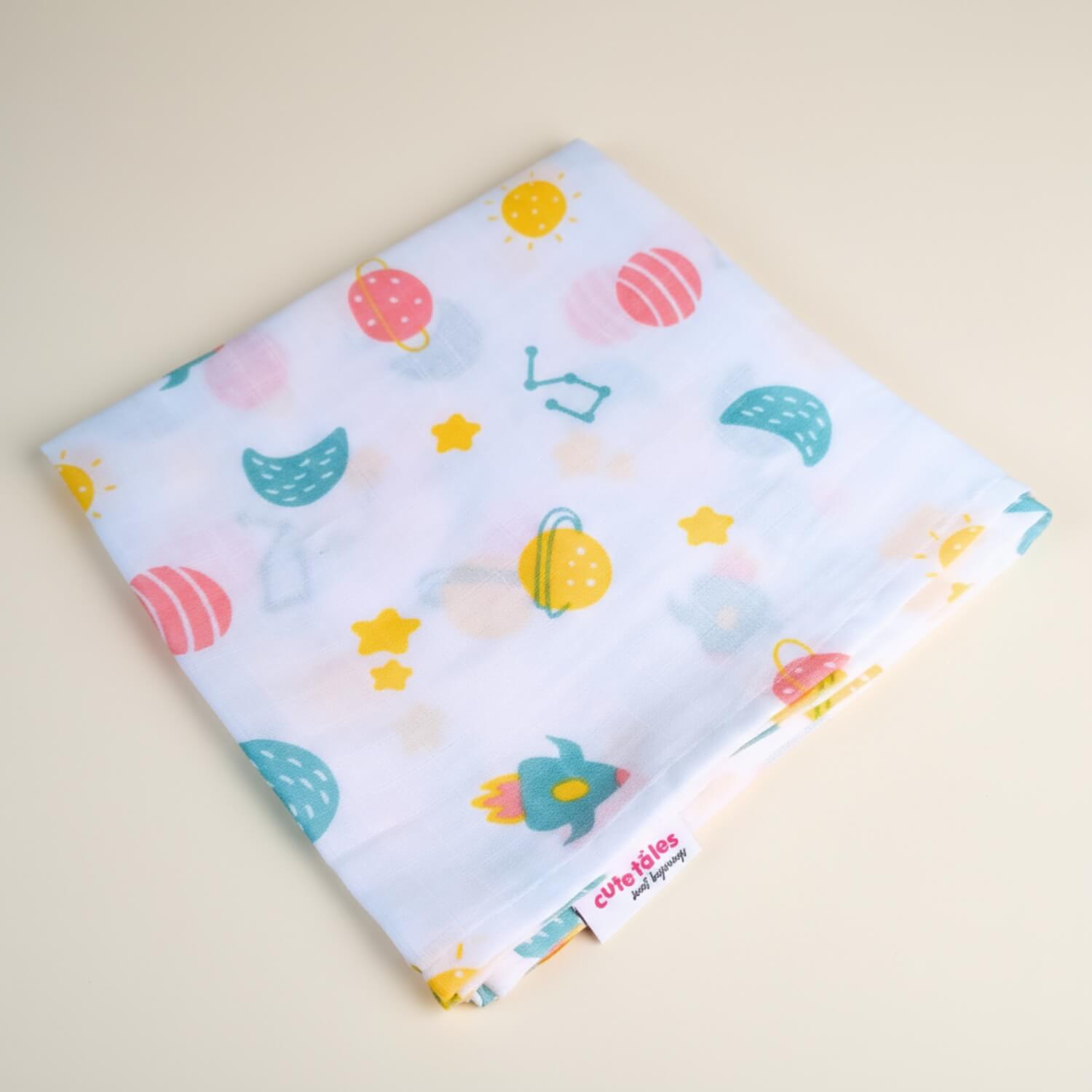 Cutetales Children's fabric with space-themed pattern on a beige background